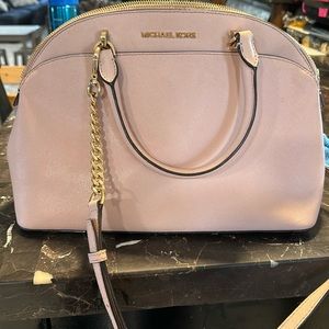 Light pink medium size Michael Kors handbag with gold hardware. Gently used